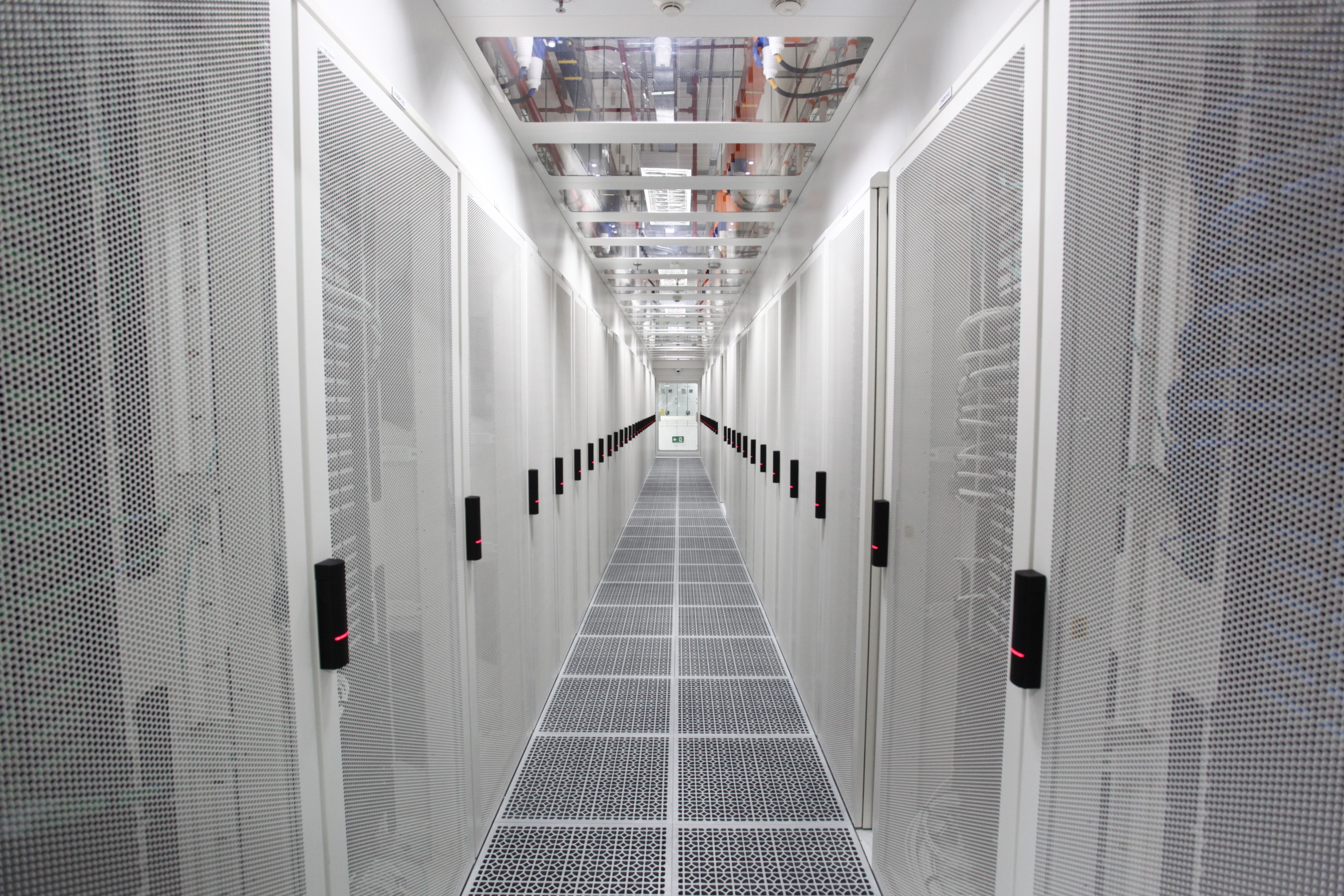 Cold aisle containment reduces energy consumption by cooling only the aisles or rows of server rack fronts, instead of cooling the entire data hall